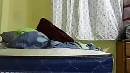 Young latina employee flirts seductively in bedroom