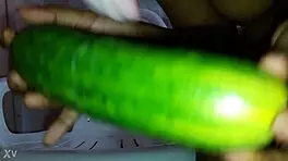 Mel masturbates with cucumber.