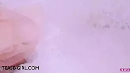 enchanting brunette muse enjoys a sensual bath