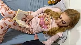 Petite girl playfully massages guy's large member