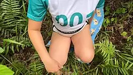 enjoying outdoor intimacy in the woods with a climax