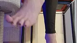 Woman in Black Leggings Teases with Subtle Fingering