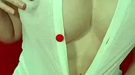 Pretty blonde teases huge tits in see-through dress close-up amateur