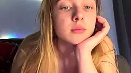 Blonde teen teases wet pussy with fingers to orgasm