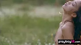 petite filipina kit rysha strips nude in wildflower field