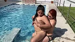 two latinas heat up the pool with steamy lesbian fingering and licking