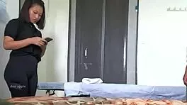 A young girl receives a relaxing handjob during massage session.