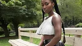 ebony beauty flashes big natural tits behind leather skirt outdoors