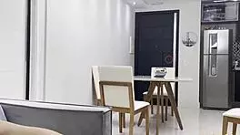 slid right into her tight ass while girlfriend cooked in sheer lingerie