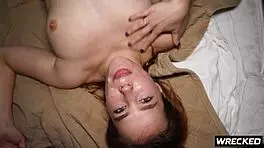 Two guys roughly double penetrate moaning redhead teen doggystyle