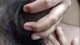 desi hottie strokes cock with feet while buzzing on bed