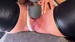 Big vibrator pulses clitoris making juicy pussy squirt orgasm close-up