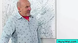 Sexy blonde pours nuru gel rubs natural tits on client 🥵