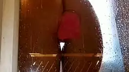 Appetizing ass girl spreads wide for pink toy fun in steamy shower.