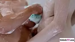 passionate milf licks and fingers young shaved pussy in steamy shower tribbing