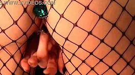Blonde Teen Fingers Shaved Pussy In Fishnets With Buttplug Inserted