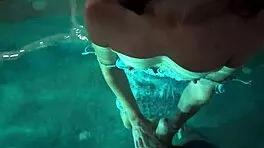 teasing babe seduces with outdoor pool play