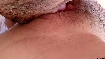 Extreme close-up of young unshaved pussy squirting from wild clit eating.