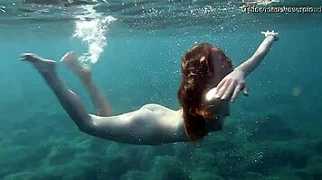 In Tenerife, Hot Ginger Teen 18+ Swims Underwater, Showing Off Bikini in Public Pool Scene