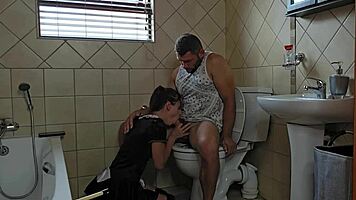 Petite slut performs oral on cock in toilet